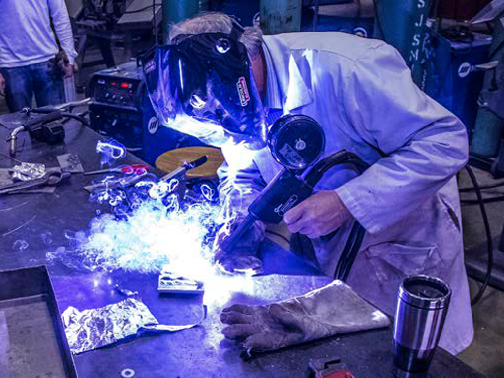 Student welding in lab.