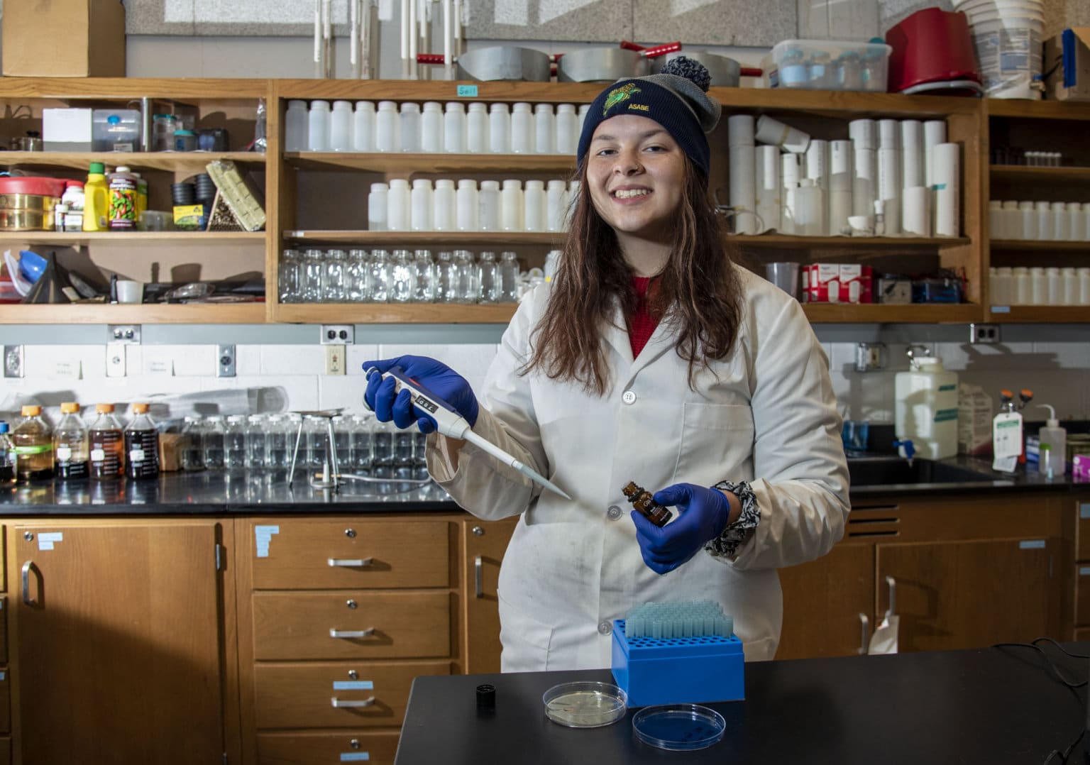 A student poses in a lab