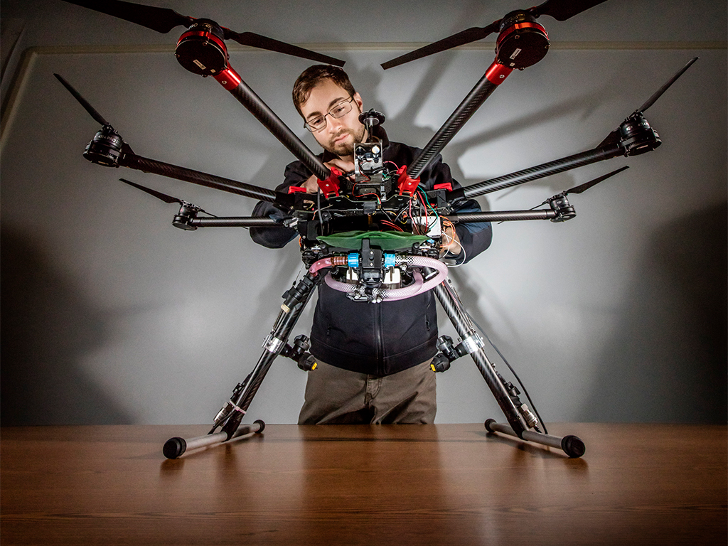 Student working on drone equipment.