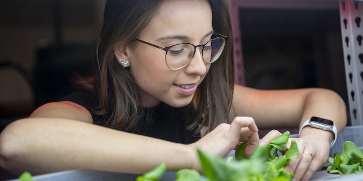 Student examining plants 