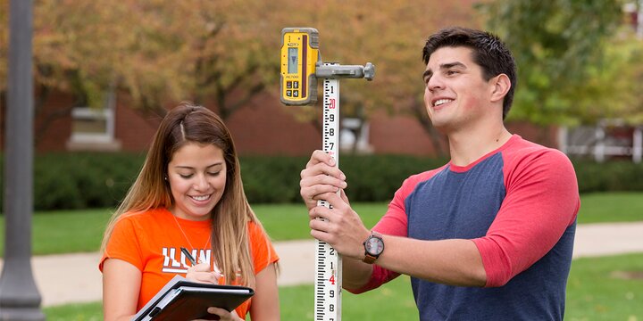 Students using surveying equipiment.