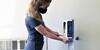 Student using IBRL hand sanitizer station
